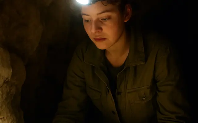 She Crawled Into the Cave and Found a Nest of Golden Eggs. Then Three Figures in Black Coats Blocked the Way Out.